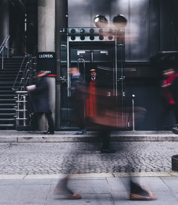 Bustling side walk with blurred figures